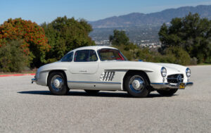 Lots of times they show classic Mercedes-Benz Cars in Iconic Movies; one example is The Solid Gold Cadillac movie where they show a 300SL Gullwing (in the picture)
